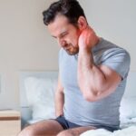 Man Looking To Prevent Neck And Shoulder Pain From Sleeping Wrong