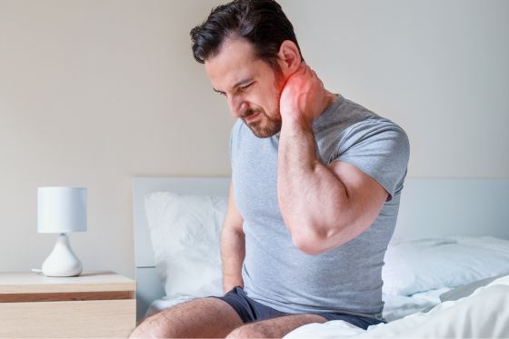 Man Looking To Prevent Neck And Shoulder Pain From Sleeping Wrong